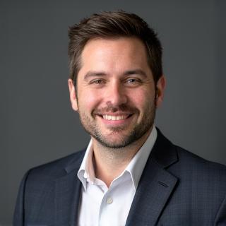 Professional headshot of Benjamin Carter.